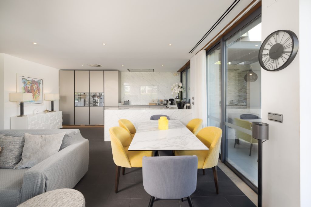 Indoor dining area with modern table and seating for six guests